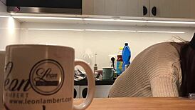 Young amateur wife washes dishes while voyeur camera records