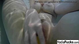 Sexy Nadia Enjoys a Relaxing Bath with Playful Rubber Duckies.