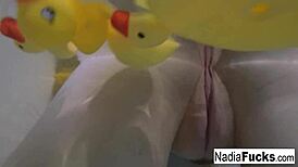 Sexy Nadia Enjoys a Relaxing Bath with Playful Rubber Duckies.