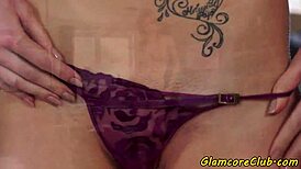 European model with tattoos showcases solo glamour in classy photoshoot