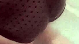 Asian girl masturbates in bathroom watching porn with dildo