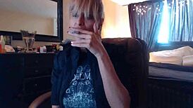 Blonde Sandi Smokes Cigarettes While Squirting on Big Tits