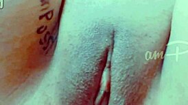 She fingers her shaved pussy closeup