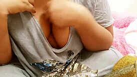 The brother's wife, an indian beauty, shows off her big boobs in the room.