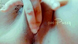 She fingers her shaved pussy closeup