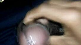 Shemale with big cock gets cumshot while sounding, hairy details unfold in the scene