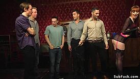 Redhead takes on double penetration with kinky domination at a wild party.