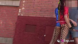 Harley Quinn cosplayer meets and interacts with guys on the street