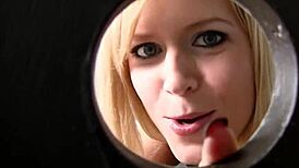 this blonde milf works the texas glory hole in the bathroom for a cum load.