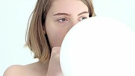 wow, this young looner babe pops her first balloon