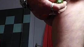 granny shocks by banging hairy pussy with cucumber in kitchen.