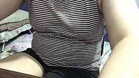 Filipina girlfriend flashes natural tits while alone at home