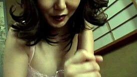 Hot japanese brunette gives natural tits handjob closeup 😍