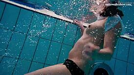 horny teen 18+ strips fast in pool showing tight pussy underwater