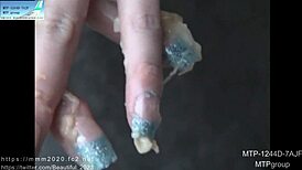 Look at these artificial nails fingering that tight asian pussy.
