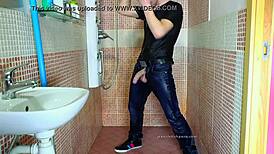 Gay guy jerks off in shower with jeans fetish.