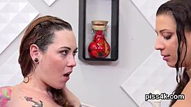 Lovesome Lezzie Nymphos Soaked in Urine, Blasting Wet Pussies