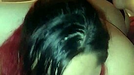 Redhead gives deepthroat blowjob in casual setting.