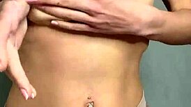 a student caresses her natural breasts at home