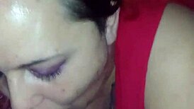 Redhead gives deepthroat blowjob in casual setting.