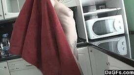 horny babe gropes herself in the kitchen