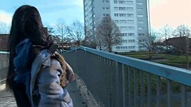 Naughty and horny strips and pisses in the middle of the street in front.