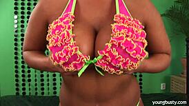 Busty young Lucie enjoys a solo peeing session