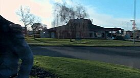 Naughty and horny strips and pisses in the middle of the street in front.