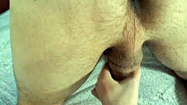 Close-up handjob in doggy position