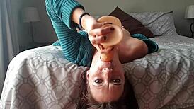She says, 'Watch this upside down dildo gag deepthroat with choking.'