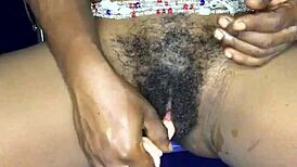 That sexy ebony girl from Ghana is using a dildo on her pussy and ass.