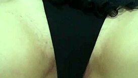 Teasing the redhead's pink pussy with gentle caresses.