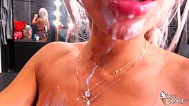 beautiful blonde deepthroats and plays with milk, cum on face
