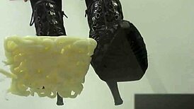 Asian babe stomps noodles in shoes for foot fetish excitement.