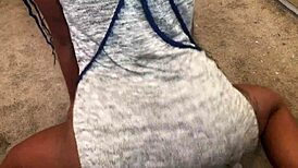 Twerking reveals panties under skirt in teasing upskirt display.