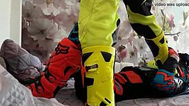 Gay biker treads boots in motocross costume fun