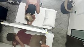Real video of masseur having sex with woman next to her husband.