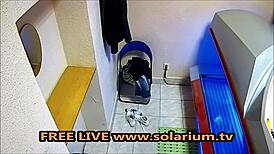 horny milf with big breasts masturbates in solarium.