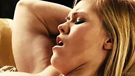 delphine fingers her shaved pussy solo on the sofa