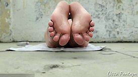 Beautiful oiled feet sunbaking in sexy fetish scene