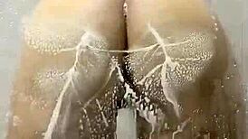 Pawg rides dildo in wet shower with big ass moaning.