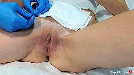 Feeling relaxed during depilation by beautician in latex gloves