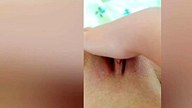 cute young girl reveals legs then fingers wet shaved pussy