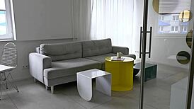 horny blonde girl is browsing through fashion magazines while feeling aroused and touching herself