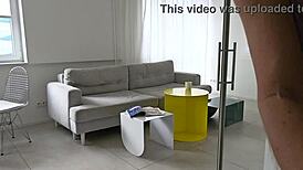 horny blonde girl is browsing through fashion magazines while feeling aroused and touching herself