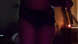 Latina woman teases with her big ass and rips clothes in striptease.