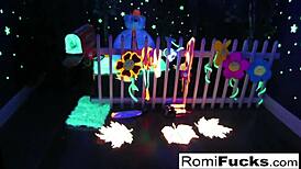 Romi Rain and Dani devour each other's pussies in black-light lesbian fun!