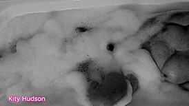Kitty Hudson enjoys a relaxing bath with a toy