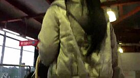 Jacket and boots candidly exposed on the train street scene.