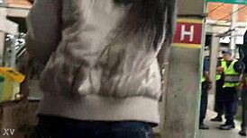 Jacket and boots candidly exposed on the train street scene.